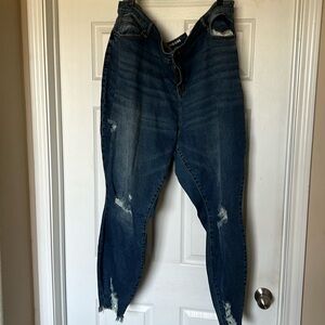 Distressed skinny leg high rise jeans